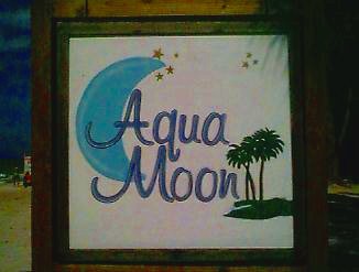 Aqua Moon's sign on the beach in Negril, Jamaica
