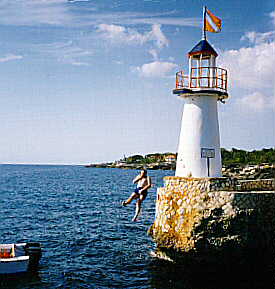 Rich at 50 Jumping Off the Mariner's Inn Lighthouse in Negril Jamaica